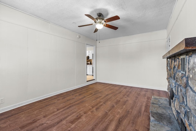 unfurnished living room featuring a textured ceiling, hardwood / wood-style floors, and ceiling fan