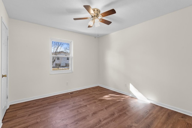 unfurnished room with ceiling fan and wood-type flooring