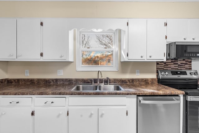 kitchen featuring sink, stainless steel appliances, and white cabinetry