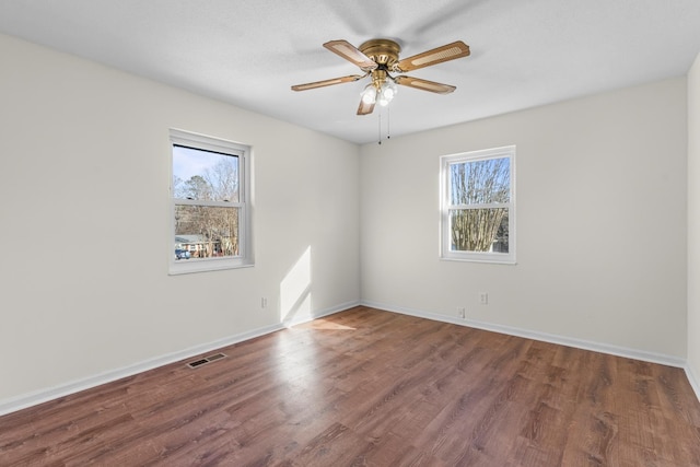 unfurnished room with wood-type flooring and ceiling fan