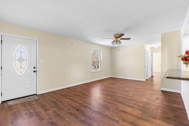 entryway with ceiling fan and dark hardwood / wood-style flooring