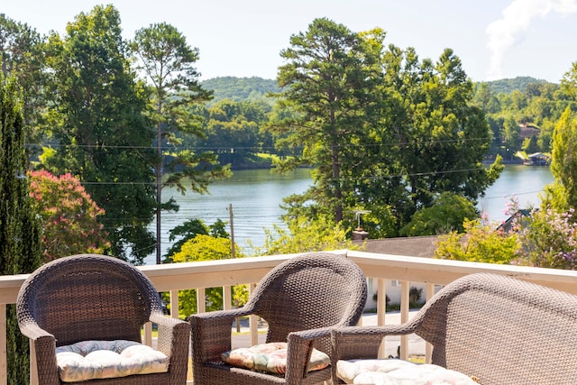 balcony featuring a water view