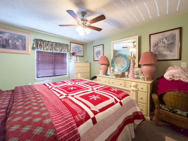 carpeted bedroom with a textured ceiling and ceiling fan