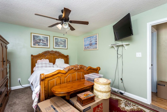 bedroom with a textured ceiling and ceiling fan