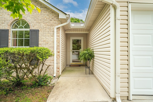 7826 Stone Garden Way, Powell, TN 37849 - property entrance featuring a garage and brick siding