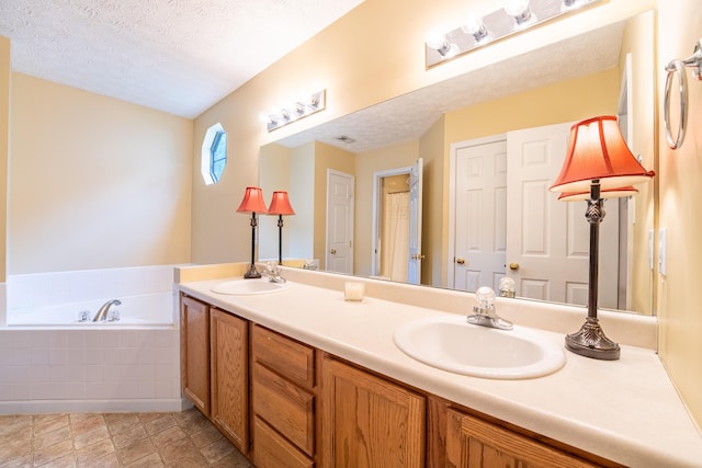 7826 Stone Garden Way, Powell, TN 37849 - full bath featuring a garden tub, a textured ceiling, and double vanity