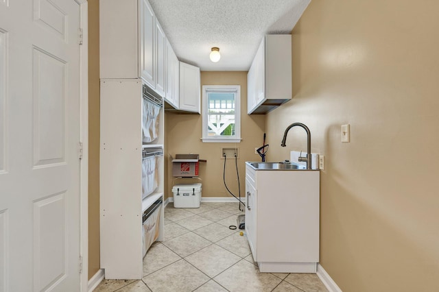 271 Hidden Oaks Trl NE, Cleveland, TN 37312 - kitchen with white cabinetry, light tile patterned floors, and a textured ceiling
