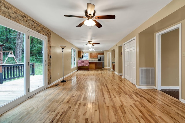 271 Hidden Oaks Trl NE, Cleveland, TN 37312 - unfurnished living room featuring light wood finished floors and ceiling fan