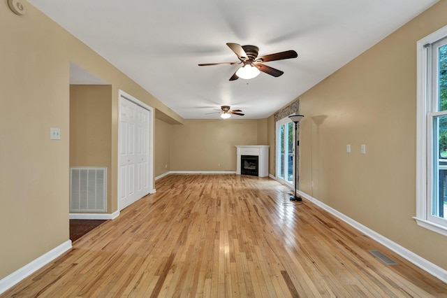 271 Hidden Oaks Trl NE, Cleveland, TN 37312 - unfurnished living room with ceiling fan, plenty of natural light, and light wood-type flooring