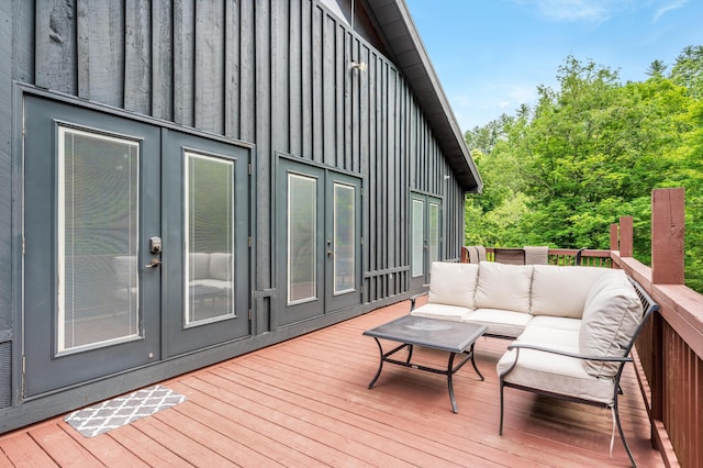 wooden terrace featuring an outdoor hangout area