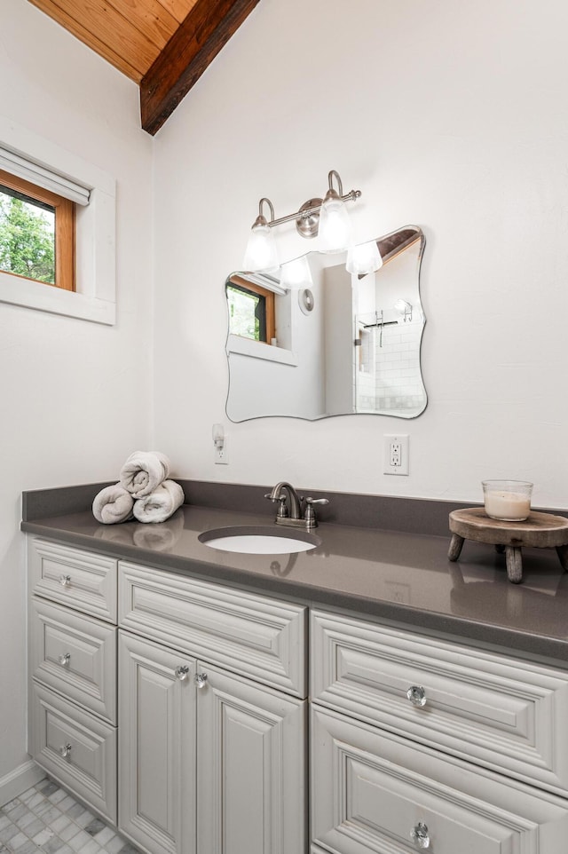 bathroom with lofted ceiling, vanity, and wooden ceiling