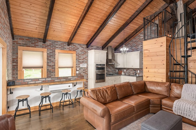 living room featuring high vaulted ceiling, brick wall, beamed ceiling, wood-type flooring, and wood ceiling