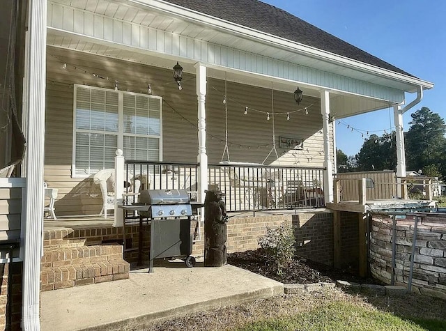 exterior space with a porch and grilling area