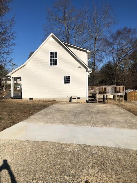 view of side of property with a deck