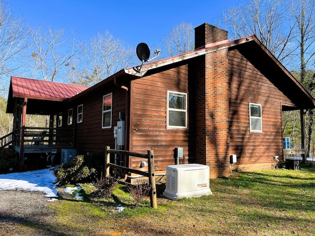 view of home's exterior with a lawn