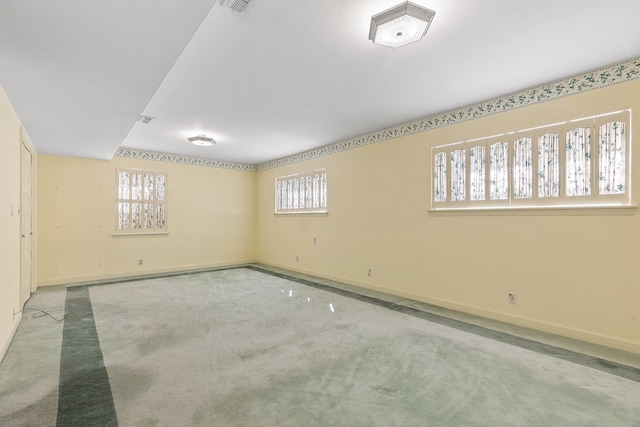 basement with carpet flooring and a healthy amount of sunlight