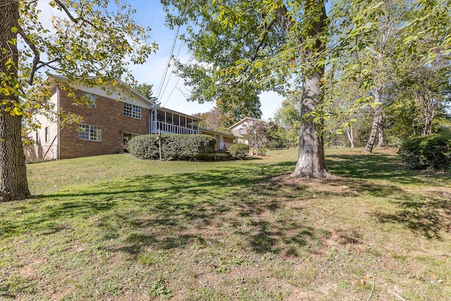 view of yard with a sunroom