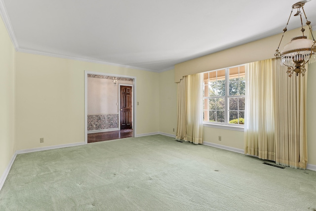 carpeted empty room with ornamental molding