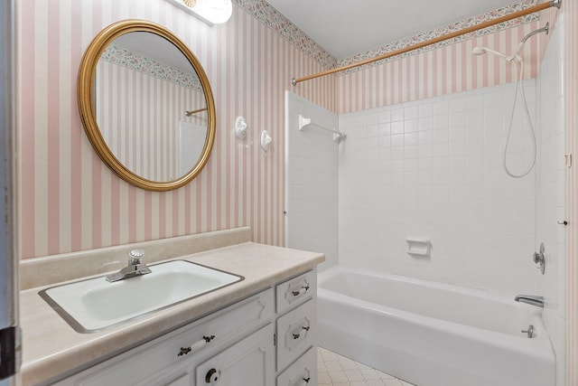 bathroom with vanity and tiled shower / bath combo