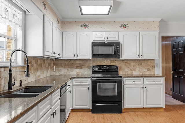 kitchen featuring black appliances, light hardwood / wood-style floors, white cabinets, and sink