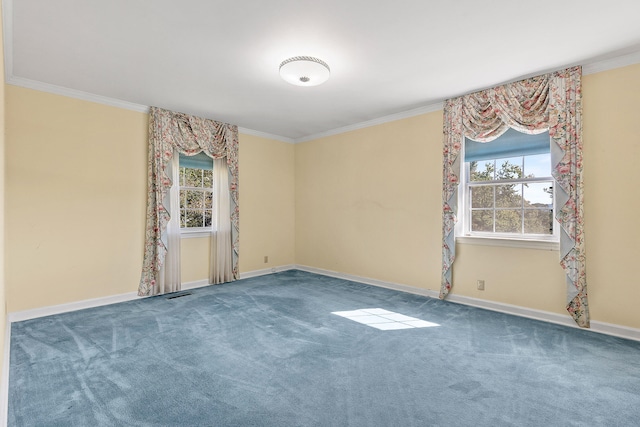 carpeted empty room featuring crown molding