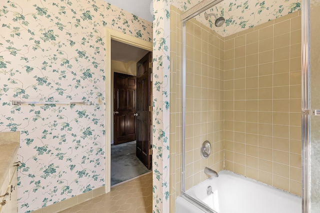 bathroom featuring tile patterned flooring and combined bath / shower with glass door