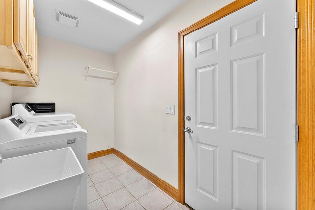 407 Kahite Trl, Vonore, TN 37885 - laundry room with cabinet space, separate washer and dryer, baseboards, and light tile patterned flooring