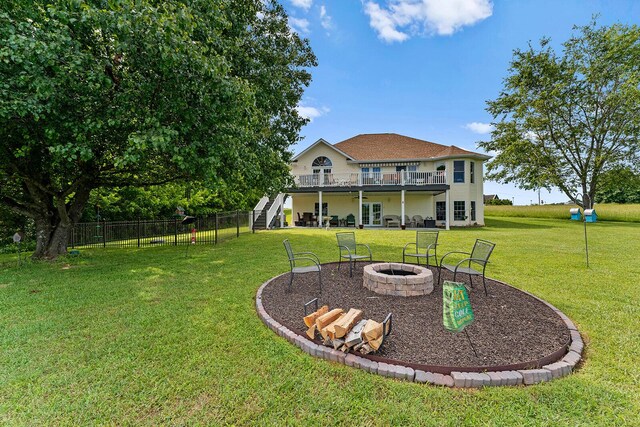 407 Kahite Trl, Vonore, TN 37885 - back of property featuring an outdoor fire pit, stairs, a wooden deck, and a patio