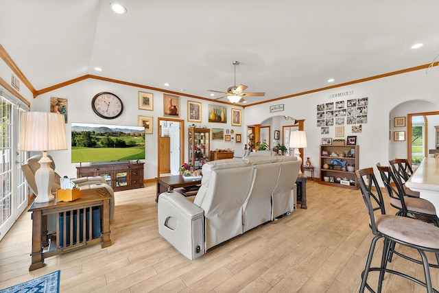 407 Kahite Trl, Vonore, TN 37885 - living area featuring arched walkways, healthy amount of natural light, crown molding, a ceiling fan, and light wood-style floors