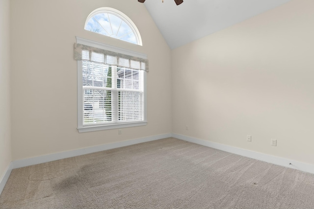 empty room featuring plenty of natural light, carpet flooring, and ceiling fan