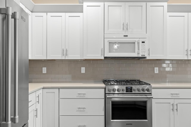 kitchen with appliances with stainless steel finishes and white cabinets