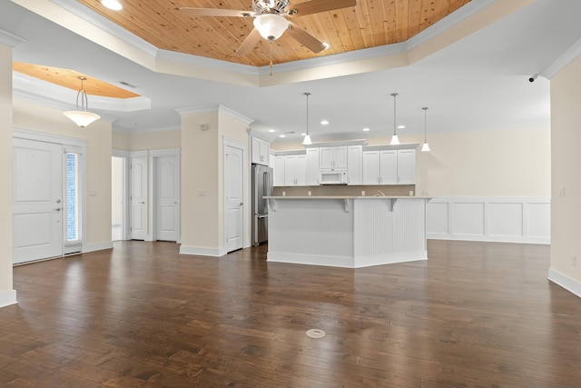 unfurnished living room featuring a raised ceiling, crown molding, dark wood-type flooring, and wooden ceiling