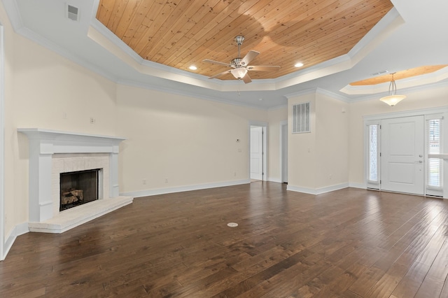 unfurnished living room with a raised ceiling, crown molding, and wooden ceiling