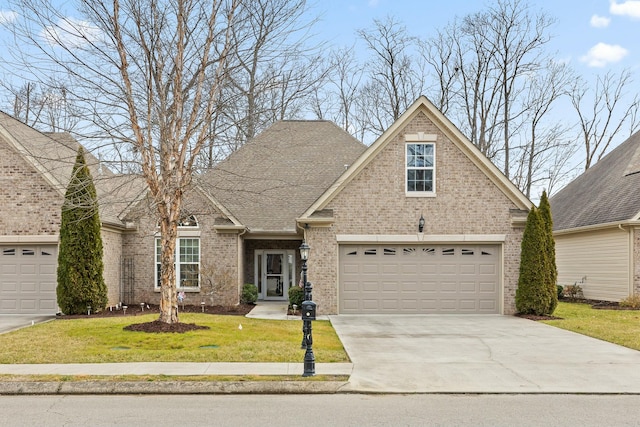 view of front of home with a garage and a front yard