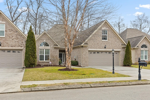 view of front property with a garage and a front yard