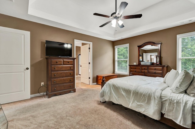 1851 Preservation Dr NE, Cleveland, TN 37323 - bedroom featuring a raised ceiling, light carpet, baseboards, and a ceiling fan