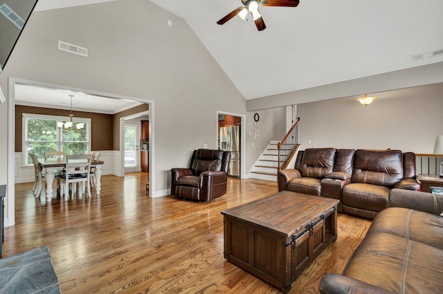 1851 Preservation Dr NE, Cleveland, TN 37323 - living area with ceiling fan, high vaulted ceiling, light wood-style flooring, stairway, and a chandelier
