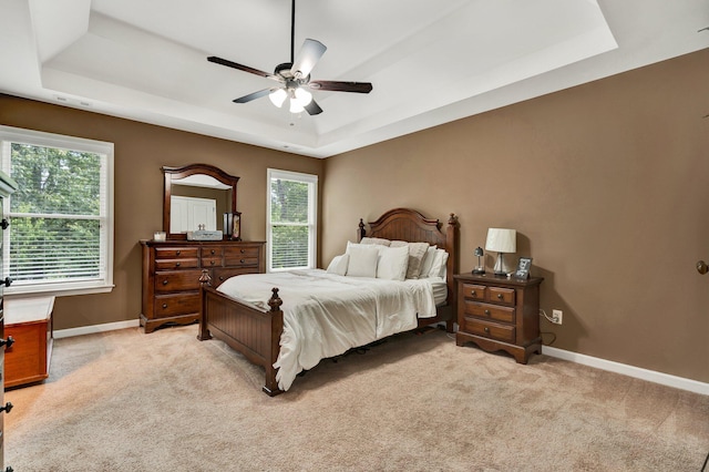 1851 Preservation Dr NE, Cleveland, TN 37323 - bedroom featuring a raised ceiling, light colored carpet, baseboards, and a ceiling fan