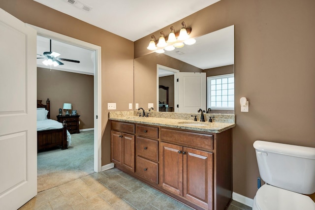 1851 Preservation Dr NE, Cleveland, TN 37323 - bathroom with ensuite bath, double vanity, baseboards, ceiling fan, and toilet