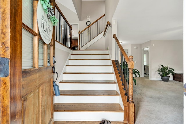 1851 Preservation Dr NE, Cleveland, TN 37323 - staircase featuring carpet flooring, baseboards, and a high ceiling