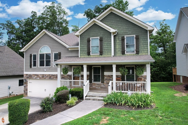 1851 Preservation Dr NE, Cleveland, TN 37323 - craftsman-style house featuring a porch, stone siding, a front lawn, a garage, and concrete driveway