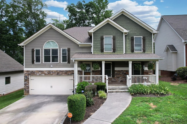 1851 Preservation Dr NE, Cleveland, TN 37323 - craftsman inspired home featuring stone siding, a porch, a garage, driveway, and a front yard