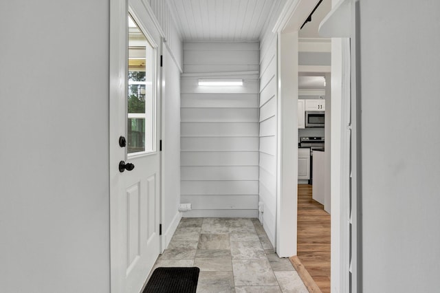 interior space featuring baseboards and ornamental molding