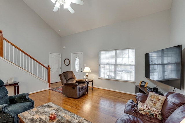 unfurnished living room featuring ceiling fan, dark hardwood / wood-style flooring, and lofted ceiling