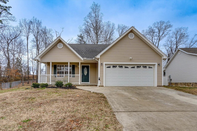 ranch-style house featuring covered porch and a garage