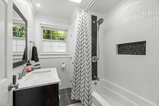 full bathroom with toilet, vanity, shower / tub combo with curtain, and ornamental molding