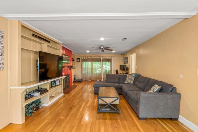 living room featuring light wood-type flooring and ceiling fan