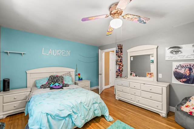 bedroom with ceiling fan and light hardwood / wood-style flooring