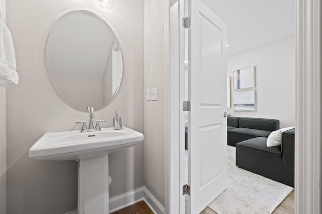 bathroom featuring baseboards and wood finished floors