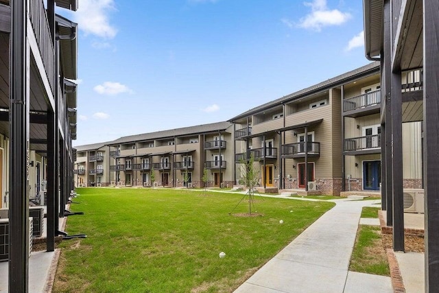 view of property's community with a lawn